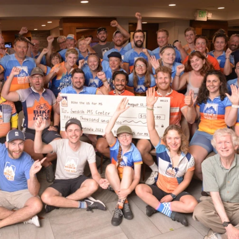 Bike the US for MS making donations to MS clinics during their MS bike rides.