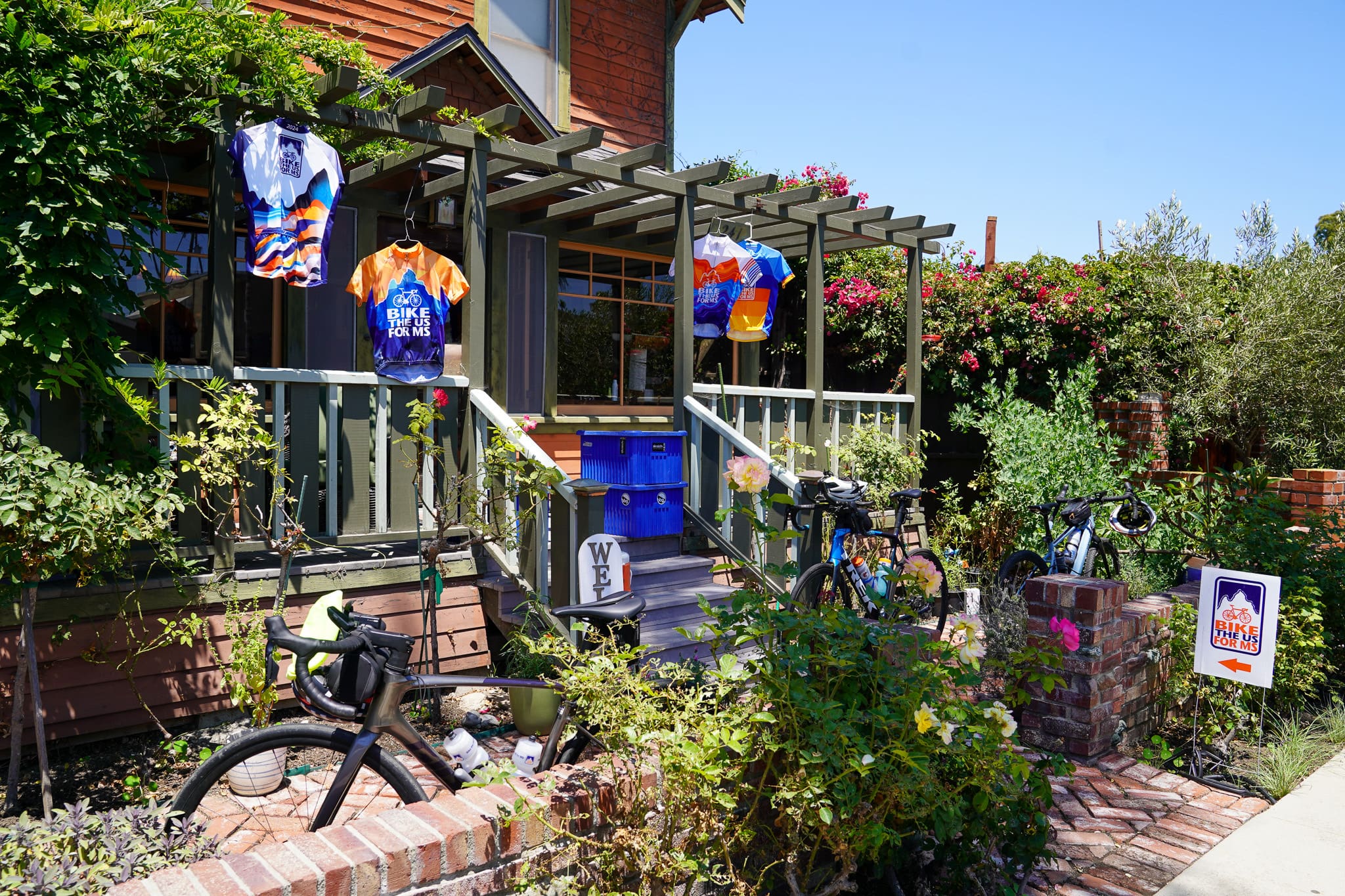 Bike the US for MS jerseys hanging from house