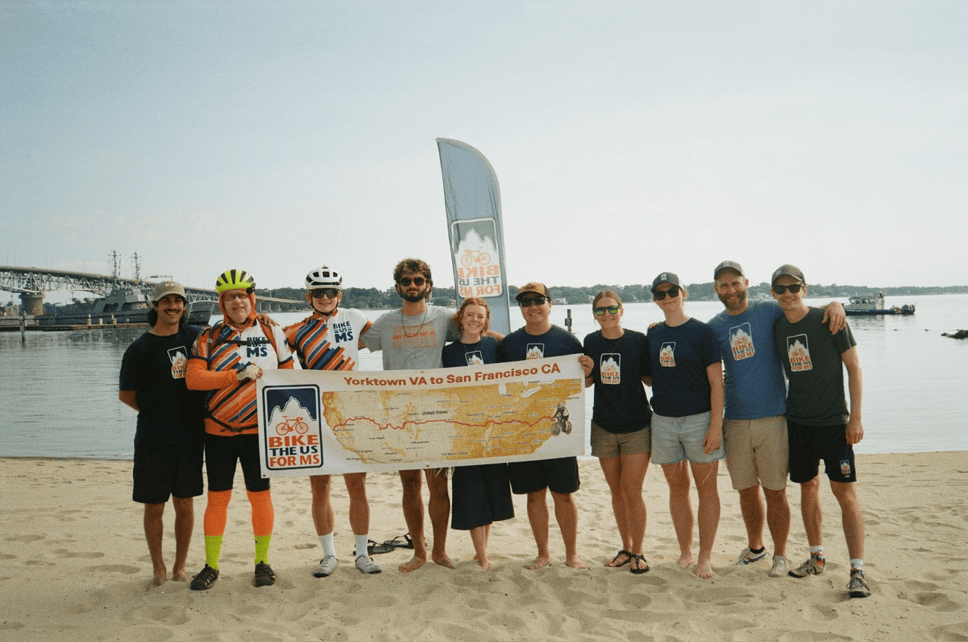 Photo of lots of route leaders on the beach in a group photo